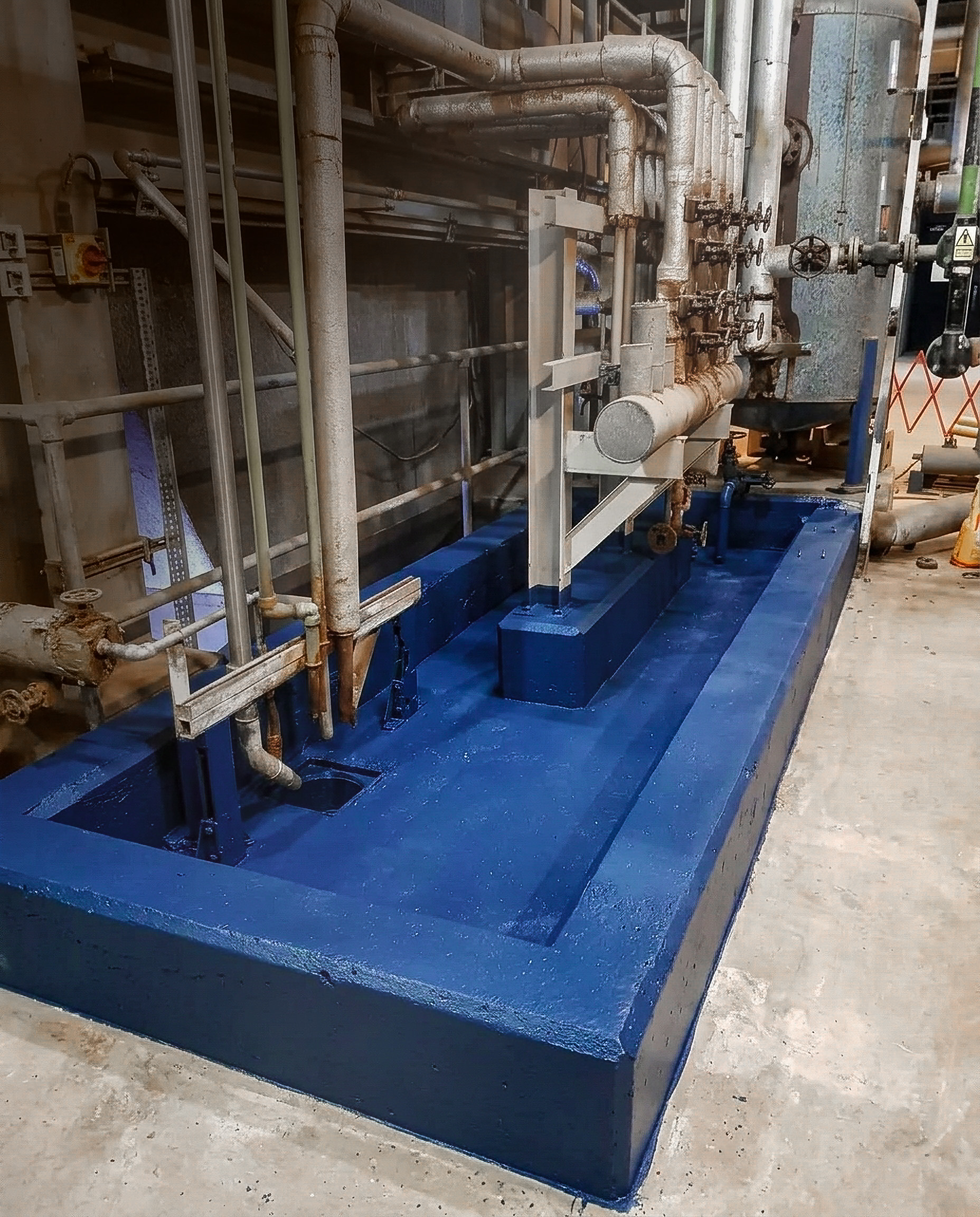 Blue polyurea sealing around industrial process equipment